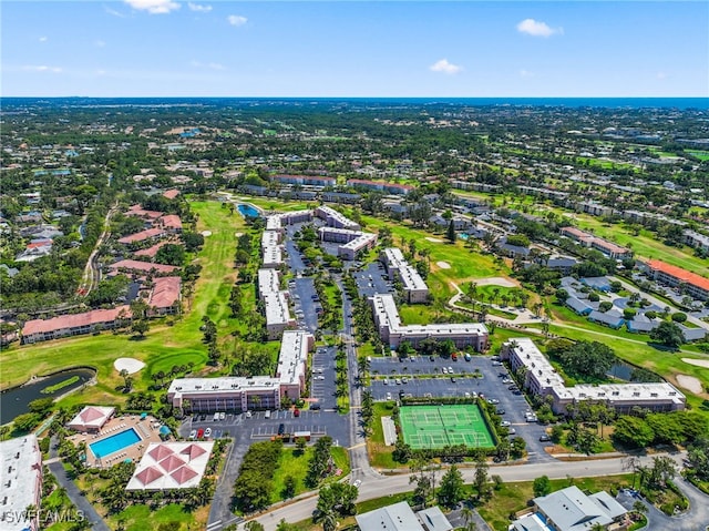 190 Turtle Lake Ct Unit 311, Naples, FL 34105 - aerial overview of property's location with a golf club, a pool area, and a large body of water