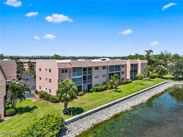 190 Turtle Lake Ct Unit 311, Naples, FL 34105 - view of apartment building / complex featuring a water view