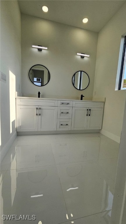 1214 Hibiscus Ave, Lehigh Acres, FL 33972 - full bathroom featuring baseboards, double vanity, recessed lighting, and marble finish flooring