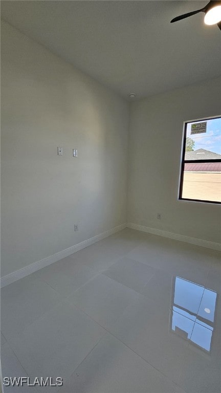 1214 Hibiscus Ave, Lehigh Acres, FL 33972 - tiled spare room with baseboards and ceiling fan