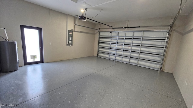 1214 Hibiscus Ave, Lehigh Acres, FL 33972 - garage featuring a garage door opener, electric panel, and water heater