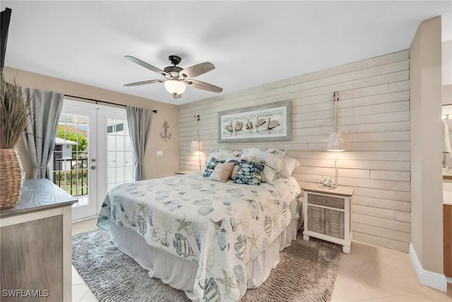 676 W Elkcam Cir Unit 1222, Marco Island, FL 34145 - tiled bedroom featuring access to exterior, wooden walls, and a ceiling fan