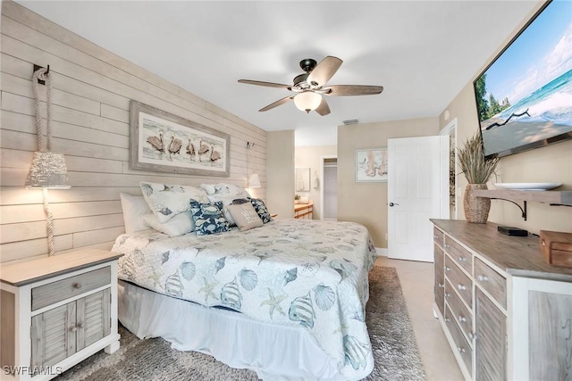 676 W Elkcam Cir Unit 1222, Marco Island, FL 34145 - carpeted bedroom featuring wooden walls and a ceiling fan