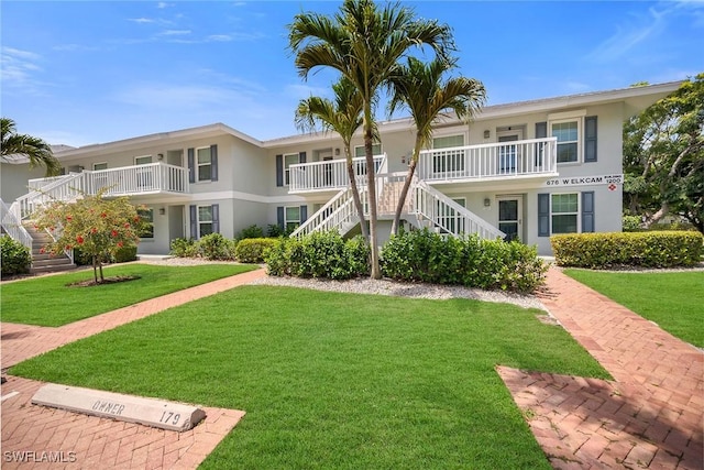 676 W Elkcam Cir Unit 1222, Marco Island, FL 34145 - view of building exterior featuring stairs