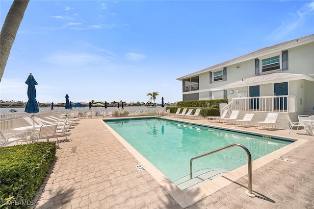 676 W Elkcam Cir Unit 1222, Marco Island, FL 34145 - community pool featuring a patio