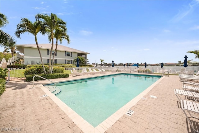 676 W Elkcam Cir Unit 1222, Marco Island, FL 34145 - community pool featuring fence and a patio area