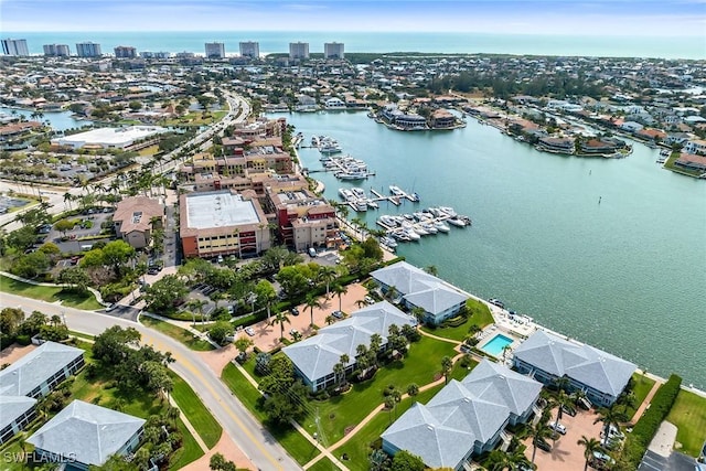 676 W Elkcam Cir Unit 1222, Marco Island, FL 34145 - aerial view of property and surrounding area featuring nearby urban area and a large body of water