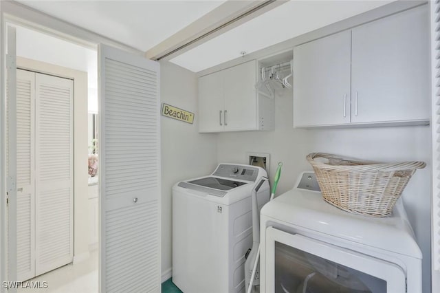 6573 Marissa Loop Unit 303, Naples, FL 34108 - washroom with washer and dryer and cabinet space
