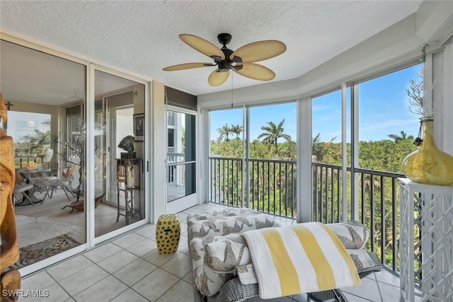 6573 Marissa Loop Unit 303, Naples, FL 34108 - sunroom / solarium featuring tile patterned flooring, ceiling fan, and a textured ceiling
