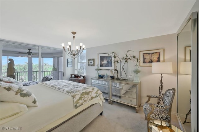 6573 Marissa Loop Unit 303, Naples, FL 34108 - bedroom with access to exterior, light colored carpet, and a chandelier