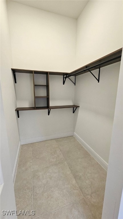 812 Hibiscus Ave, Lehigh Acres, FL 33972 - walk in closet featuring light tile patterned flooring