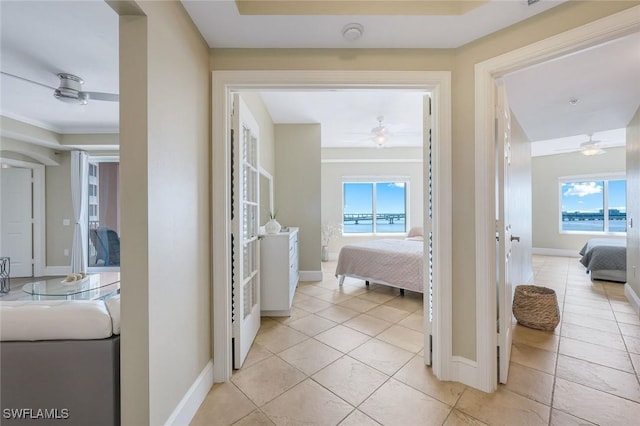 2745 1st St Unit 701, Fort Myers, FL 33916 - corridor featuring plenty of natural light, baseboards, and light tile patterned flooring