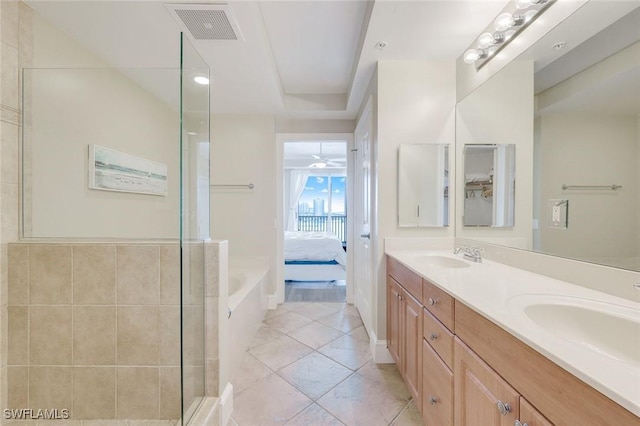 2745 1st St Unit 701, Fort Myers, FL 33916 - full bathroom with ensuite bath, a shower stall, double vanity, and tile patterned floors