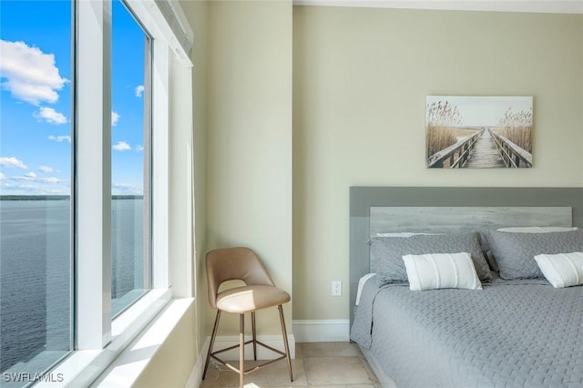 2745 1st St Unit 701, Fort Myers, FL 33916 - tiled bedroom with baseboards and a water view