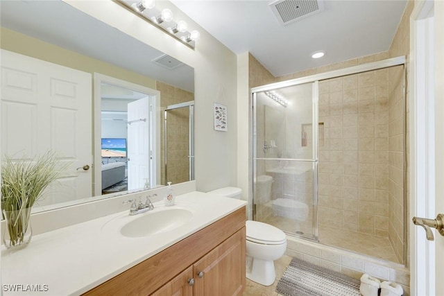 2745 1st St Unit 701, Fort Myers, FL 33916 - bathroom featuring a shower stall, ensuite bathroom, toilet, vanity, and tile patterned flooring