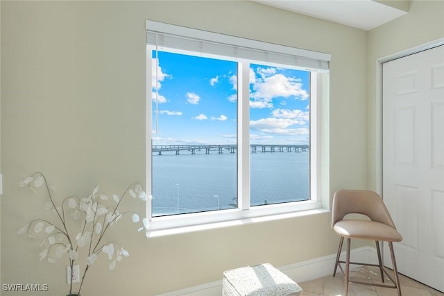 2745 1st St Unit 701, Fort Myers, FL 33916 - interior space with baseboards, a water view, and light tile patterned flooring