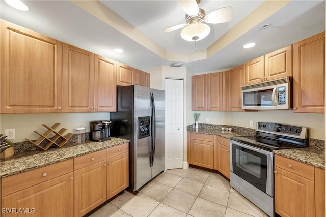 2745 1st St Unit 701, Fort Myers, FL 33916 - kitchen with appliances with stainless steel finishes, a raised ceiling, recessed lighting, light tile patterned floors, and a ceiling fan