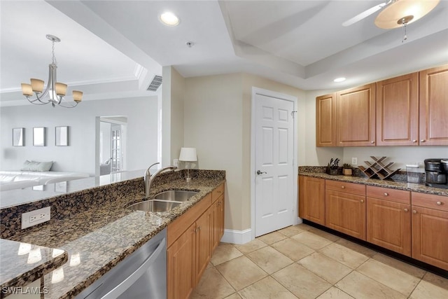 2745 1st St Unit 701, Fort Myers, FL 33916 - kitchen featuring a tray ceiling, a sink, dark stone countertops, hanging light fixtures, and recessed lighting