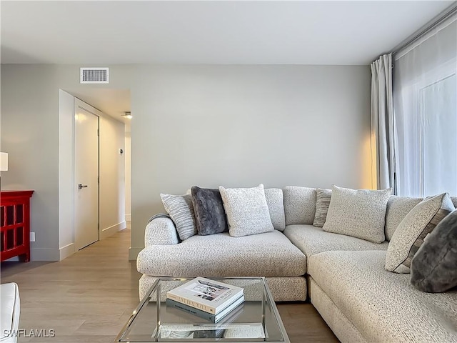 2544 1st St Unit 102, Fort Myers, FL 33901 - living room with light wood-style floors and baseboards