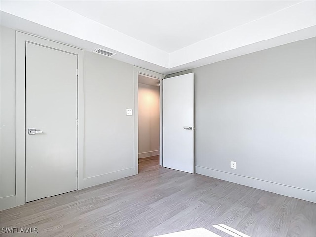 2544 1st St Unit 102, Fort Myers, FL 33901 - unfurnished bedroom featuring light wood-type flooring and baseboards