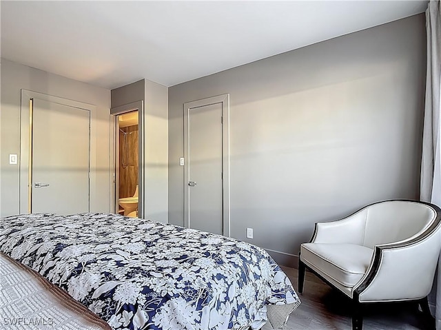 2544 1st St Unit 102, Fort Myers, FL 33901 - bedroom with wood finished floors and baseboards