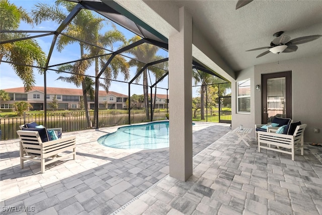 6619 Marbella Dr, Naples, FL 34105 - view of pool with ceiling fan, a patio, a residential view, and glass enclosure