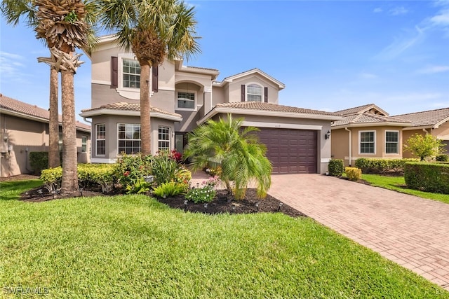 6619 Marbella Dr, Naples, FL 34105 - mediterranean / spanish-style home featuring stucco siding, decorative driveway, an attached garage, and a front lawn