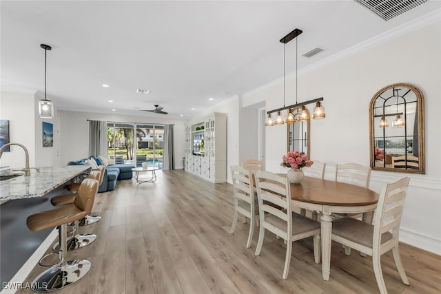 6619 Marbella Dr, Naples, FL 34105 - dining area with light wood-type flooring, ornamental molding, recessed lighting, ceiling fan, and baseboards