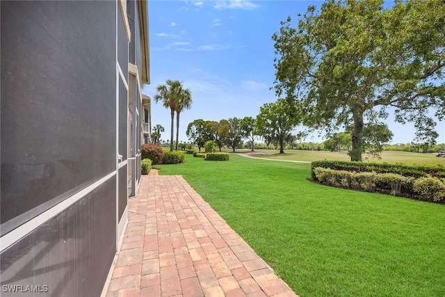 9087 Michael Cir Unit 9, Naples, FL 34113 - view of grassy yard featuring a patio area