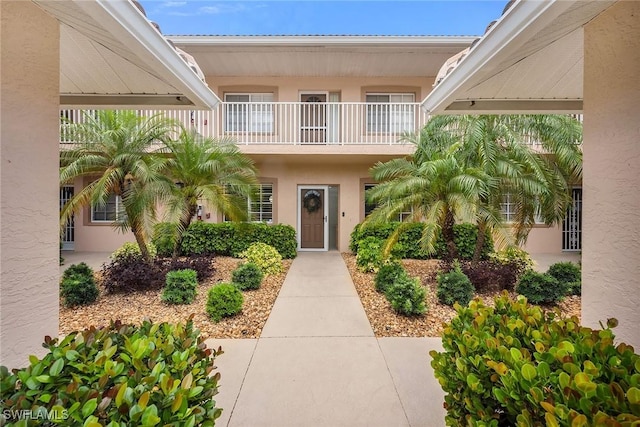 9087 Michael Cir Unit 9, Naples, FL 34113 - entrance to property featuring a balcony and stucco siding