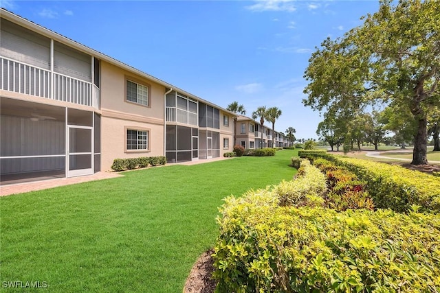 9087 Michael Cir Unit 9, Naples, FL 34113 - surrounding community featuring a lawn