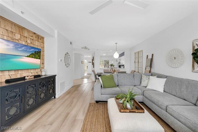 9087 Michael Cir Unit 9, Naples, FL 34113 - living room featuring light wood-type flooring