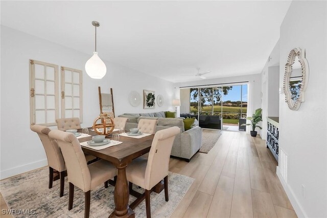 9087 Michael Cir Unit 9, Naples, FL 34113 - dining room featuring light wood-style floors and ceiling fan