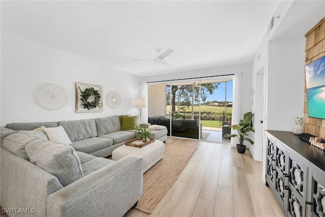 9087 Michael Cir Unit 9, Naples, FL 34113 - living room with light wood-type flooring and ceiling fan