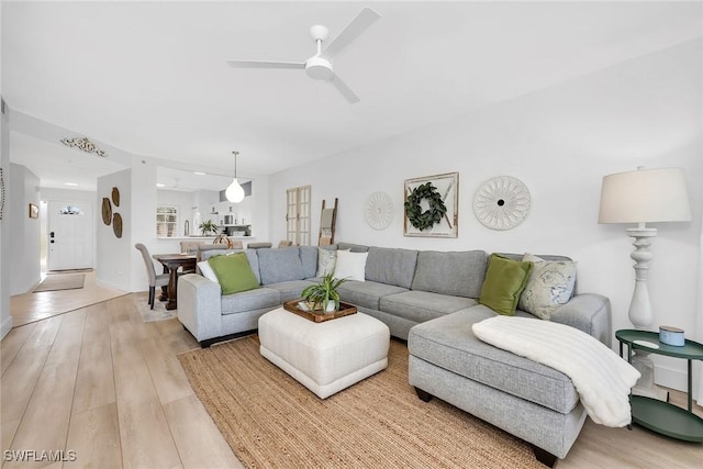9087 Michael Cir Unit 9, Naples, FL 34113 - living area featuring ceiling fan and light wood finished floors