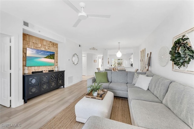 9087 Michael Cir Unit 9, Naples, FL 34113 - living area with a ceiling fan and wood finished floors