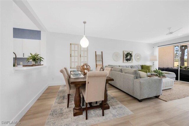 9087 Michael Cir Unit 9, Naples, FL 34113 - dining room featuring light wood-style floors and baseboards