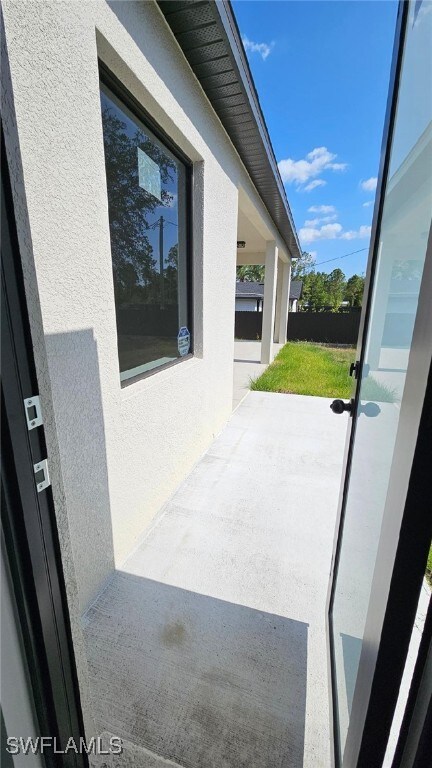 1019 Calvin Ave, Lehigh Acres, FL 33972 - view of patio featuring fence