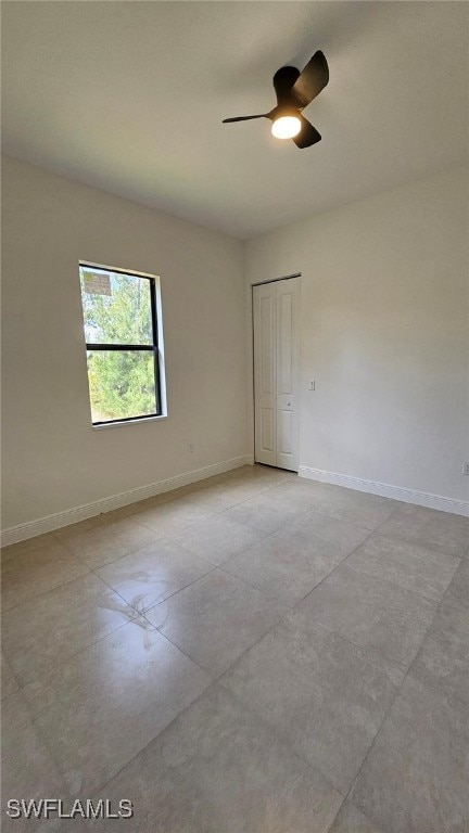 1019 Calvin Ave, Lehigh Acres, FL 33972 - empty room with ceiling fan, baseboards, and concrete floors