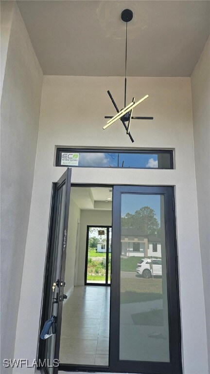 1019 Calvin Ave, Lehigh Acres, FL 33972 - doorway to property with stucco siding
