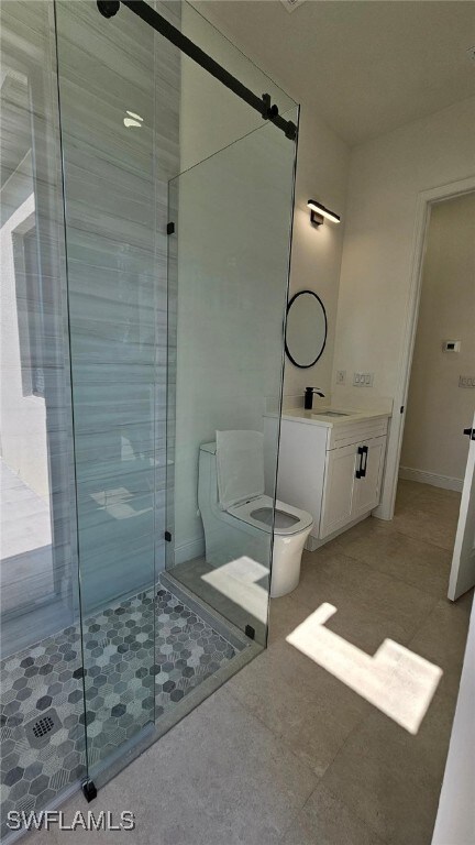 1019 Calvin Ave, Lehigh Acres, FL 33972 - bathroom with a stall shower, toilet, and vanity