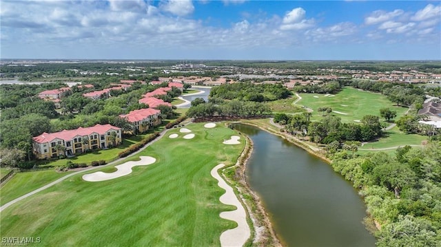 drone / aerial view of a large body of water and a golf course