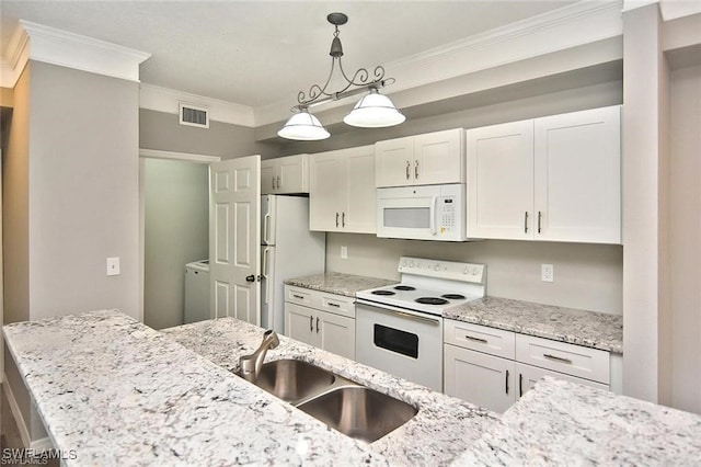 kitchen with white appliances, a sink, washer / clothes dryer, ornamental molding, and hanging light fixtures
