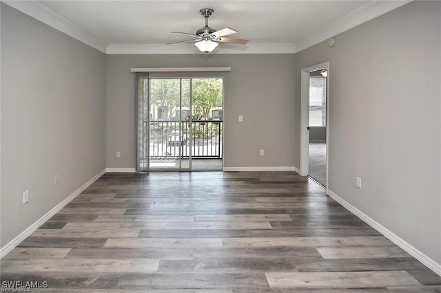 spare room with ceiling fan, crown molding, baseboards, and wood finished floors