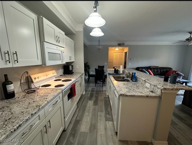 11510 Villa Grand Unit 404, Fort Myers, FL 33913 - kitchen featuring white appliances, ornamental molding, a sink, open floor plan, and dark wood-type flooring