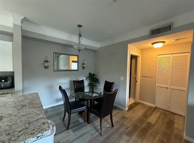 11510 Villa Grand Unit 404, Fort Myers, FL 33913 - dining room featuring crown molding, dark wood-style flooring, and baseboards