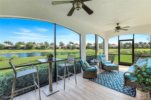 3159 Serena Ln Unit 102, Naples, FL 34114 - sunroom with ceiling fan, a water view, and outdoor lounge area