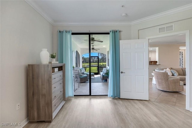 3159 Serena Ln Unit 102, Naples, FL 34114 - doorway to outside featuring light wood-style floors, crown molding, a ceiling fan, and baseboards