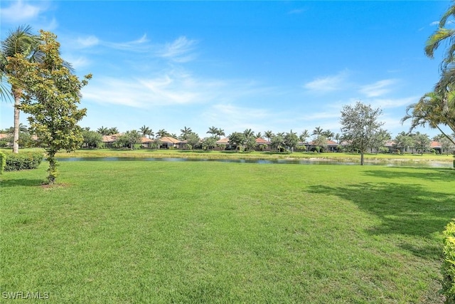 3159 Serena Ln Unit 102, Naples, FL 34114 - view of grassy yard with a water view and a residential view