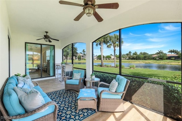 3159 Serena Ln Unit 102, Naples, FL 34114 - sunroom featuring ceiling fan and a water view